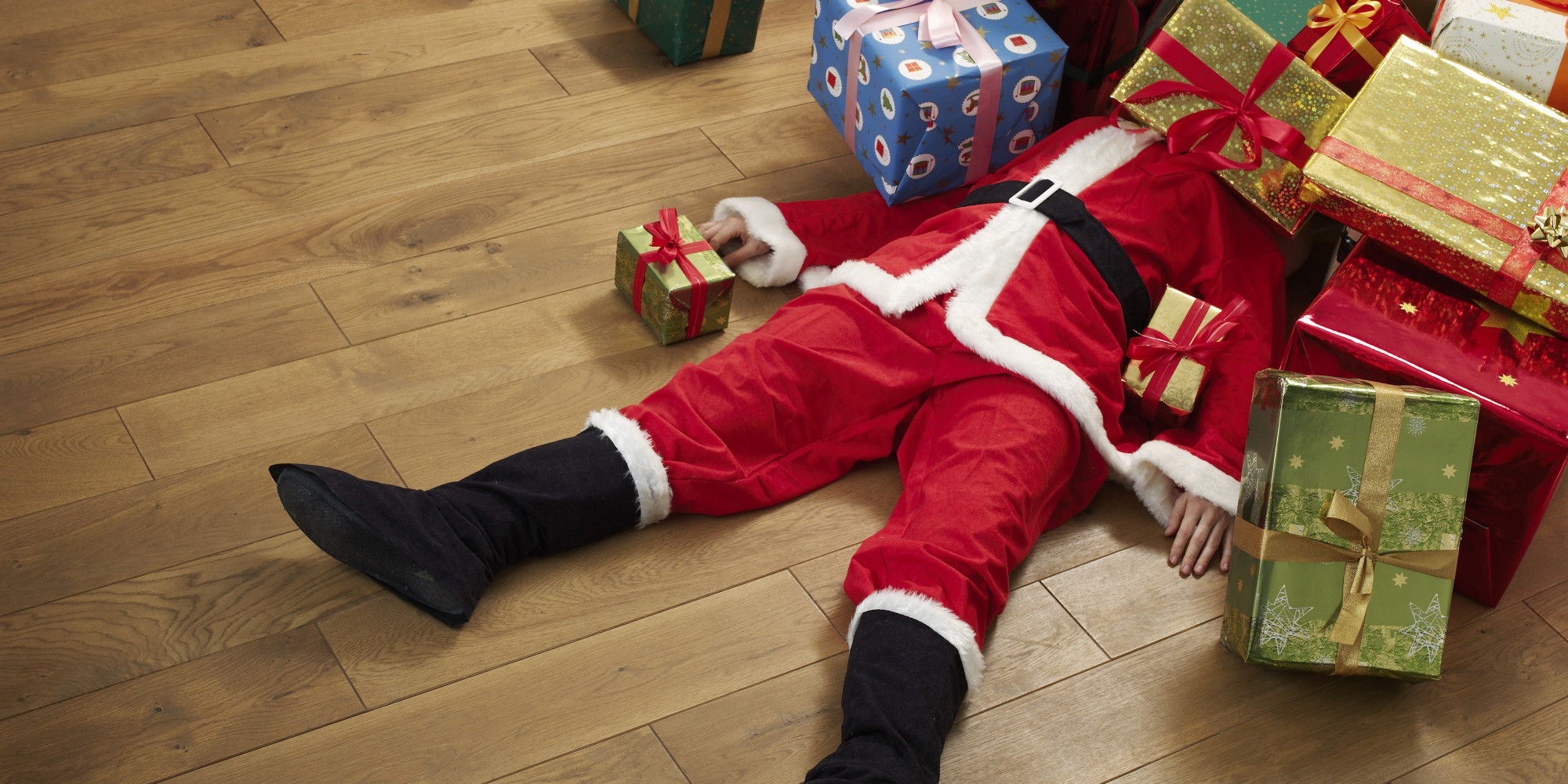 Santa Under Pile Of Presents